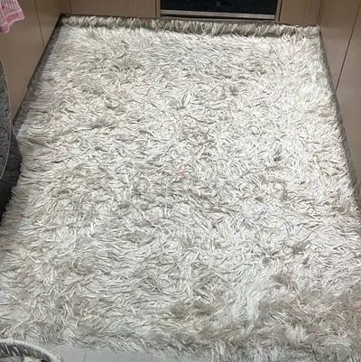 Cream shaggy rug - soft high-pile area rug, used