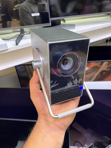 LG CineBeam Q HU710PB is a compact, portable 4K UHD smart laser projector featuring a retro-minimali