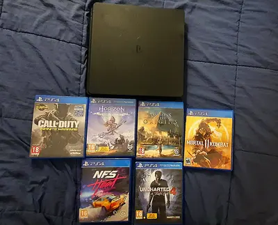 PlayStation 4 Slim console with 7 PS4 games (good working condition)