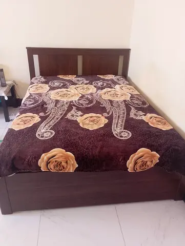 Queen-size wooden bed frame with headboard - good condition