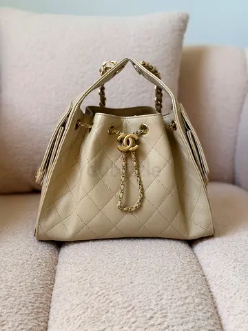 Beige Quilted Designer-Style Drawstring Handbag with Gold Chain