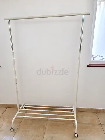 Adjustable Single Rail Clothes Rack with Wheels and Bottom Shelf