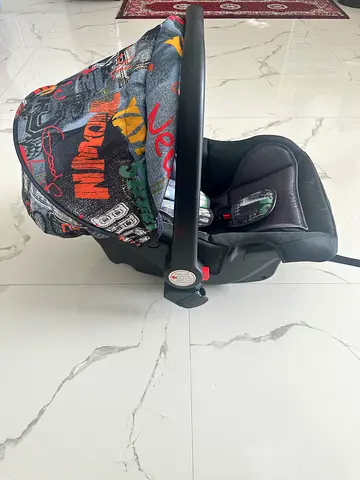 Infant car seat carrier with colorful canopy - Never used