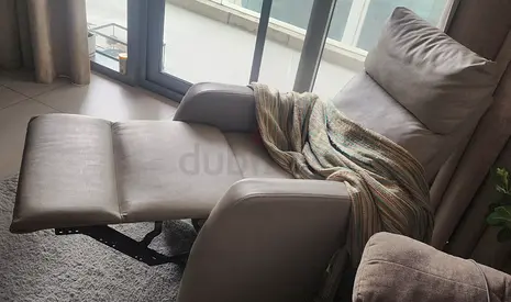 Comfortable reclining lounge chair with footrest - light beige