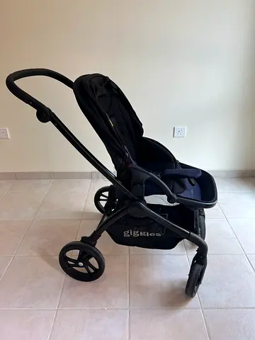 Lightweight black pram stroller with reclining seat - good condition