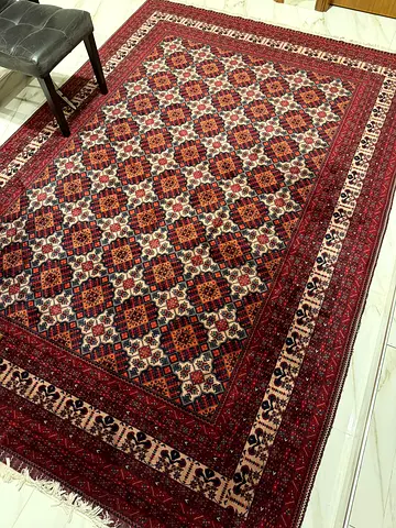 Hand made Persian-style red patterned rug - good condition, 3m length, 2m width.