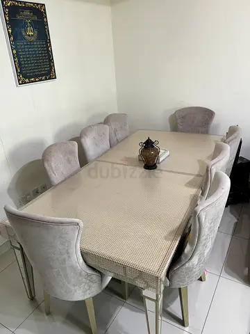 Dining table with 8 upholstered chairs - good condition