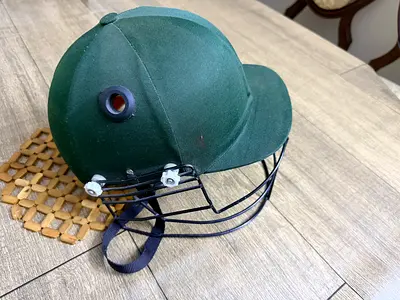 Green Cricket Helmet with Face Guard - Good Condition
