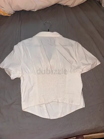 White short-sleeve smocked back blouse, size M