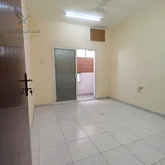 One-bedroom apartment for annual rent in Ajman's Al Nakheel district. Features a separate living roo