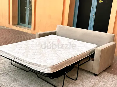 Looks great condition West Elm two seater sofa bed with mattress