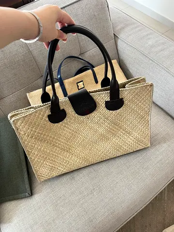 Ritz Carlton Beige woven tote bag with black leather handles