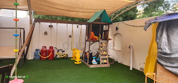 Outdoor kids playset with slide, swings and climbing tower
