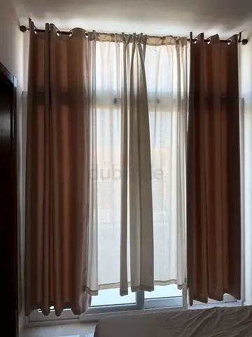 Beige layered curtains with sheer inner panels - good condition