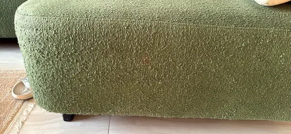 Green upholstered L shaped 5+1 seater sofa in good condition with 5 cushions 50*50 cms