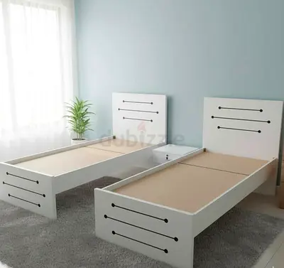 New Pair of single white wooden beds - simple modern design