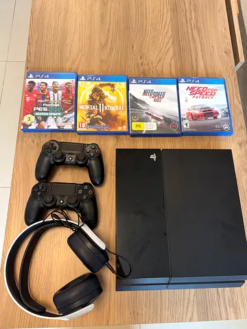 Sony PlayStation 4 1TB + 2 Controllers + Games – Excellent Condition