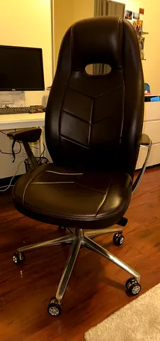 Comfortable black leather ergonomic office chair with wheels