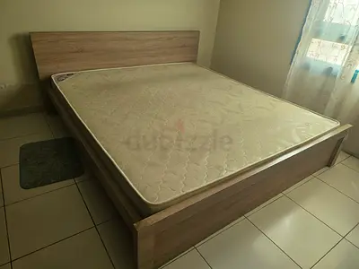 Queen bed frame with mattress — light wood, good condition
