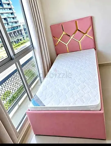 Single Pink Upholstered Bed with Headboard and Mattress