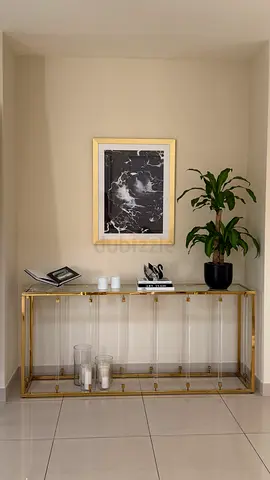 Gold and Glass Console Table with Decorative Accents