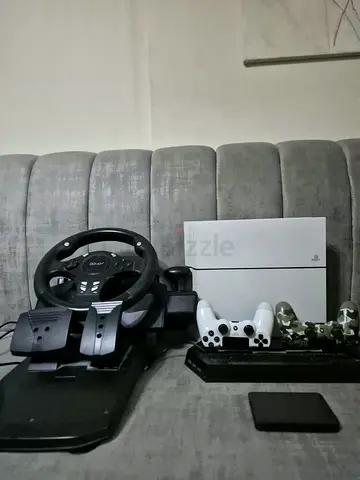PlayStation 4 Slim with Racing Wheel, 2 Controllers, 3games and storage 1tb - excellent Condition