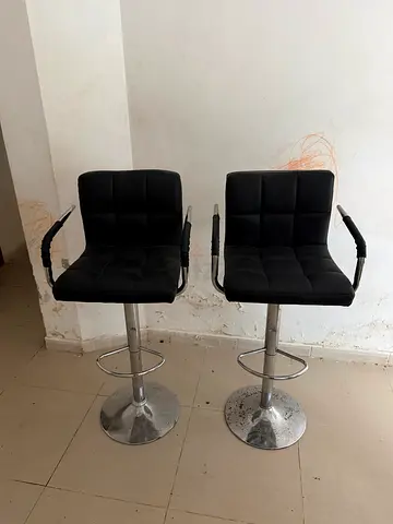 Pair of adjustable black bar stools with armrests (used)