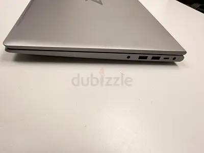 Slim silver laptop in good condition - light use