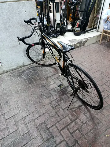 Used Road Bike - Lightweight frame with drop handlebars, good condition