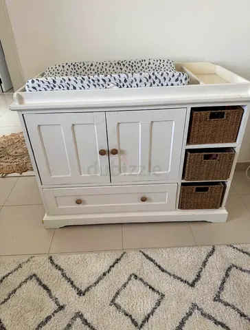Solid Wood Changing table 
Includes woven baskets and pottery barn changing mat