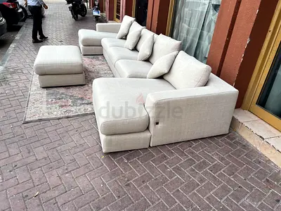 Selling in excellent Condition Pottery Barn U Shape Sofa Beige with footstool