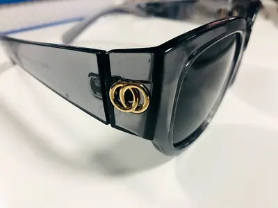 Black acetate sunglasses with gold double-ring detail