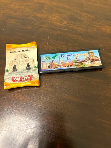 Two Pakistani souvenir fridge magnets