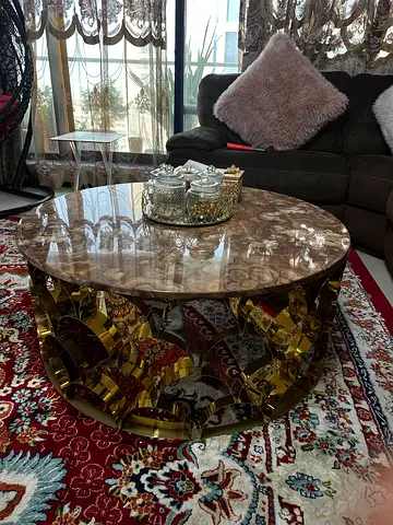 Round marble-top coffee table with gold metal base — good condition
