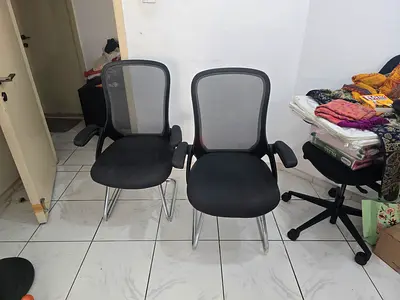 Pair of black mesh visitor office chairs - good used condition