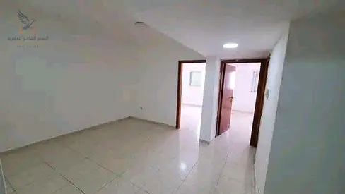 Two-bedroom apartment with a living room for monthly rent, unfurnished and without post-dated checks, in Ajman Corniche