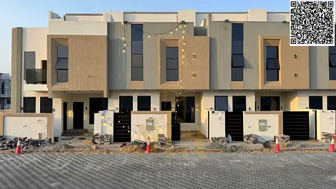 Modern two-story villa with a roof terrace for sale in Al Helio 1; features excellent specifications and is offered at an exceptional price—inclusive