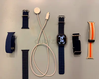 Apple Watch Ultra 2 with charger and four extra straps. In perfect condition.