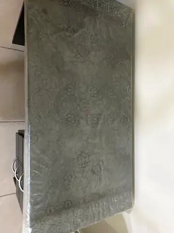 Brown patterned area rug in good condition - medium size