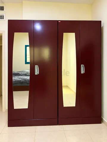 2 Stainless Steel Wardrobes with Mirrors – AED 400 Each  Selling 2 spacious and sturdy stainl