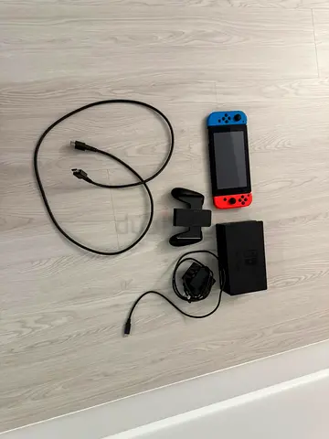 Nintendo Switch console with dock, Joy-Con controllers and cables, memory card and games