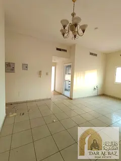 One-bedroom apartment with a living room in Al Majaz 2, featuring an open view. Includes free centra
