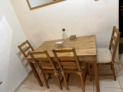 wooden dining table with matching chairs