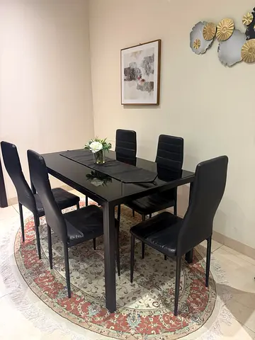 6-seater black glass dining table with leather chairs - excellent condition