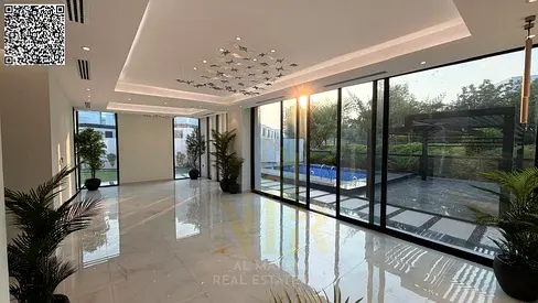 A luxurious villa for sale in Al Zorah, Ajman, featuring a prime location and an upscale residential atmosphere close to nature.
