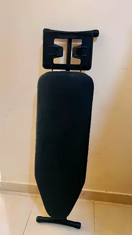 Used full-size ironing board with iron rest - good condition