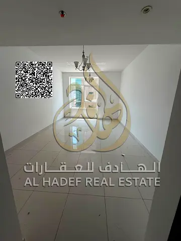Room and lounge, two bathrooms, kitchen with central gas, wall cupboards, free air conditioning, Al Rashidiya 3 on Sheikh Khalifa Street, 35,000 per y