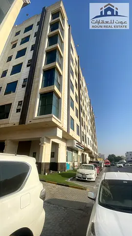 For sale: A building in Bu Shaghara, Sharjah, located near King Faisal Street. The plot is 10,000 square feet, featuring a ground floor plus 10 upper