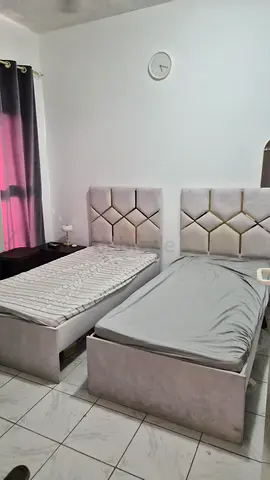 Pair of single beds with upholstered headboards - good condition