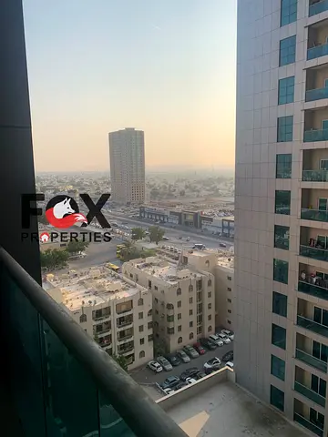 Two Bedroom Hall Apartment for Sale in City Tower Ajman with Partial Sharjah View and Parking